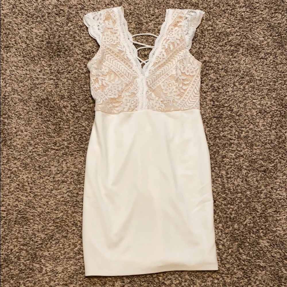 White dress with lace. Cute straps in back.